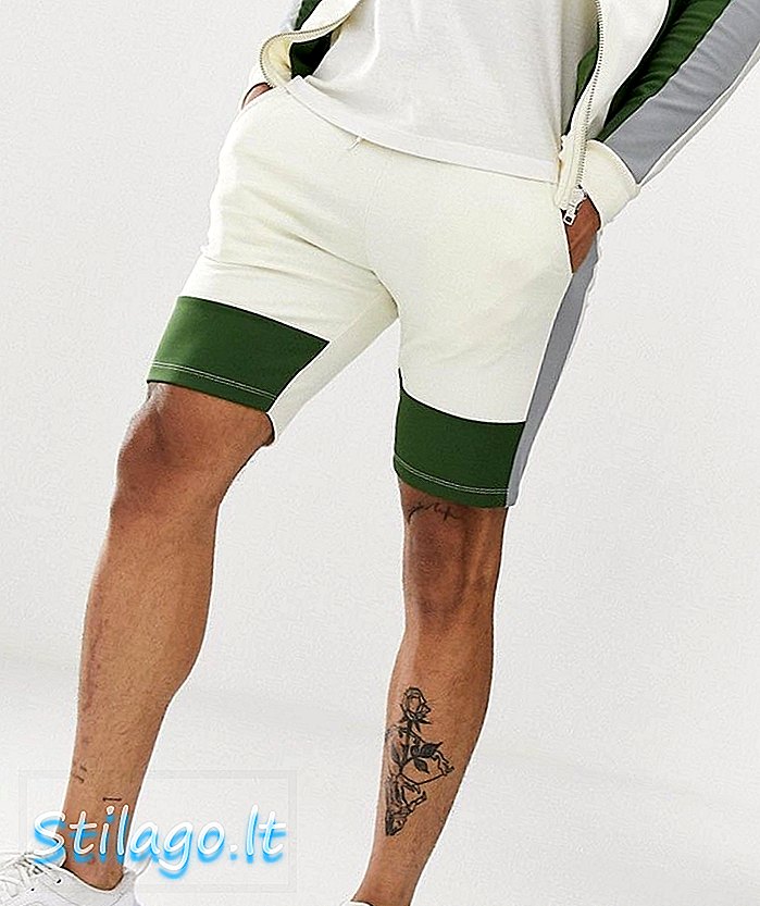 ASOS DESIGN mengkoordinasikan celana pendek skinny dalam poly tricot dengan pemblokiran warna off white