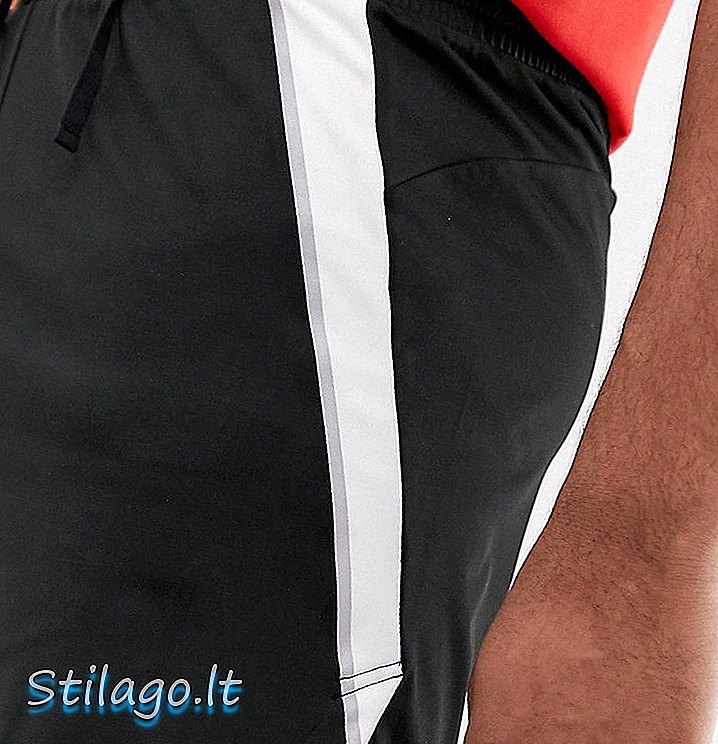 ASOS 4505 Shorts corti alti con banda laterale e fondo arrotondato in bianco e nero