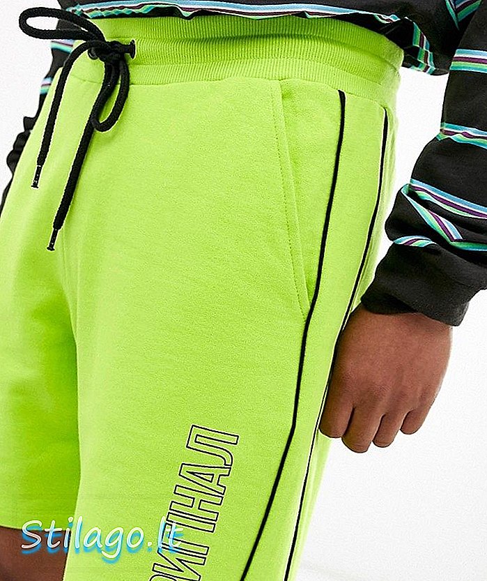 ASOS DESIGN Jersey Shorts in gewaschenem Neon mit Textdruck-Gelb