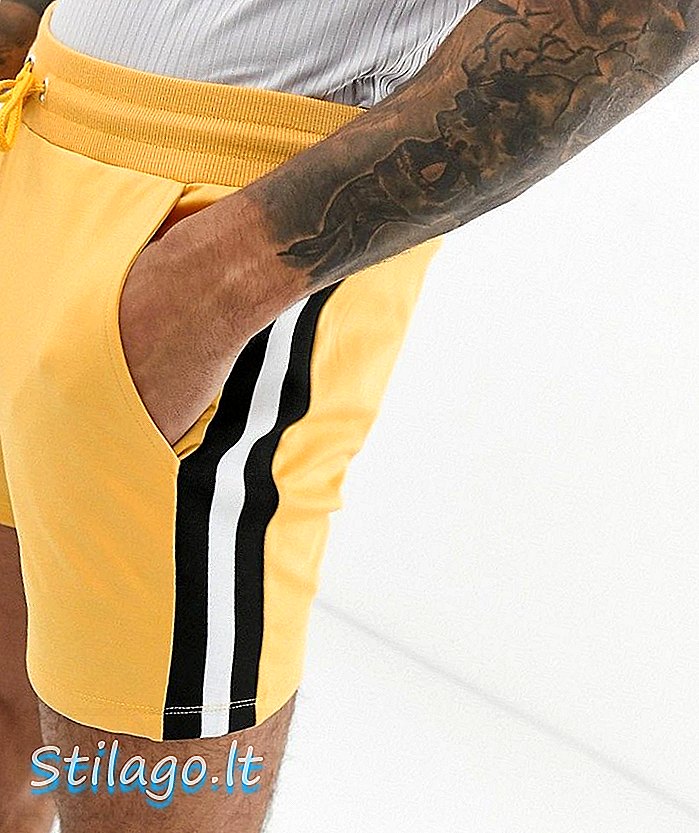 Shorts pitillo ajustados de ASOS DESIGN en poliéster tricot con franja lateral tejida en amarillo