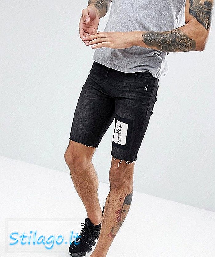 Religion skinny fit denim shorts with black with skeleton patch