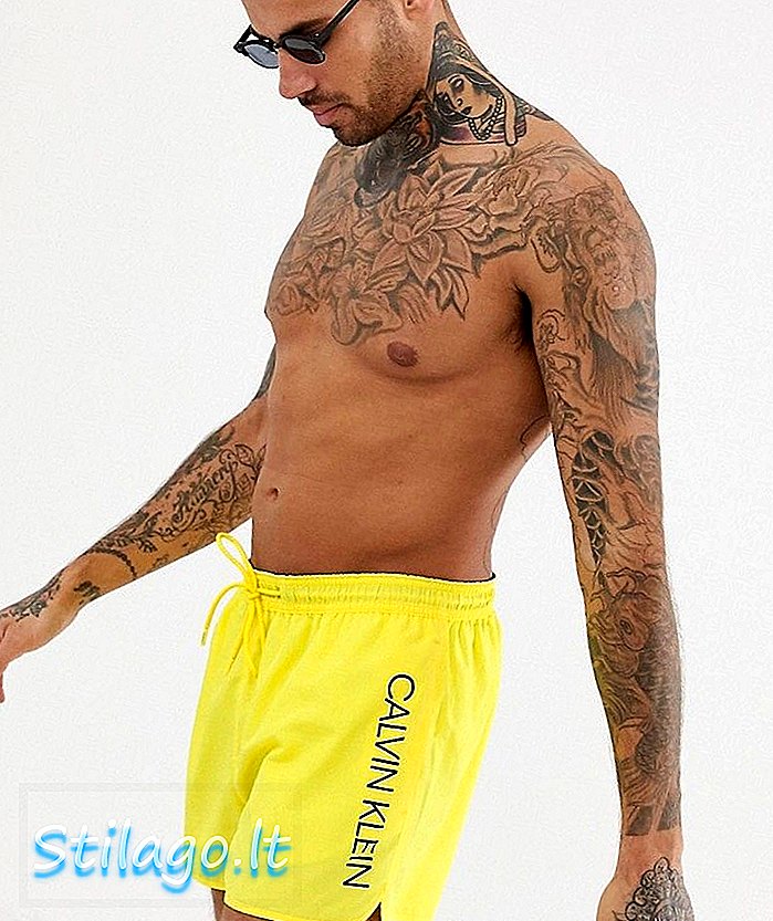 กางเกงว่ายน้ำขาสั้นโลโก้ Calvin Klein สีเหลือง
