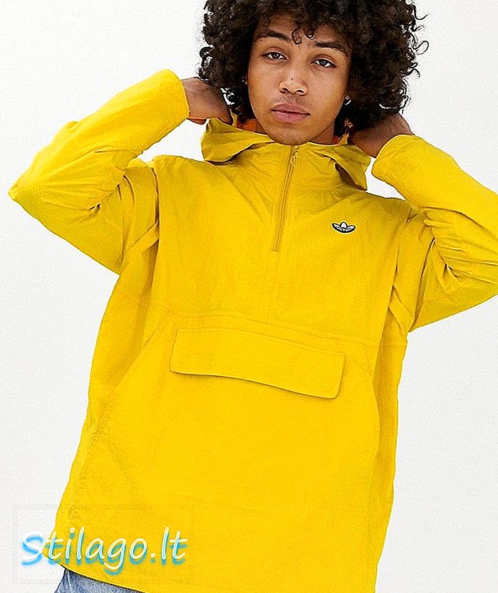 adidas Originals แจ็คเก็ตเสื้อกันลมเหนือศรีษะสีเหลืองพร้อมโลโก้พระฉายาลักษณ์